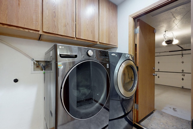 8021 Ruidoso Ct NE, Albuquerque, NM 87109 - laundry room featuring cabinet space and washer and clothes dryer