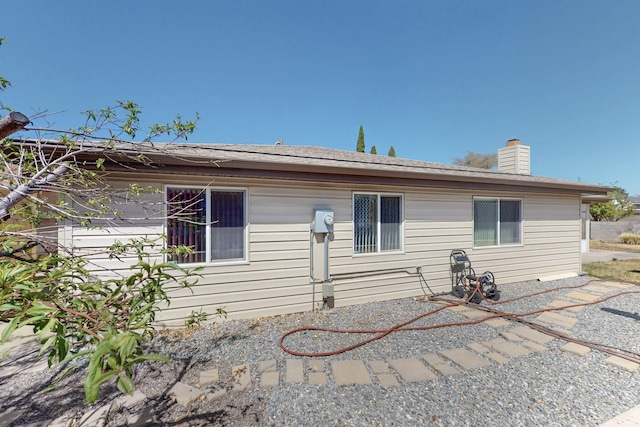 8021 Ruidoso Ct NE, Albuquerque, NM 87109 - back of house with a chimney