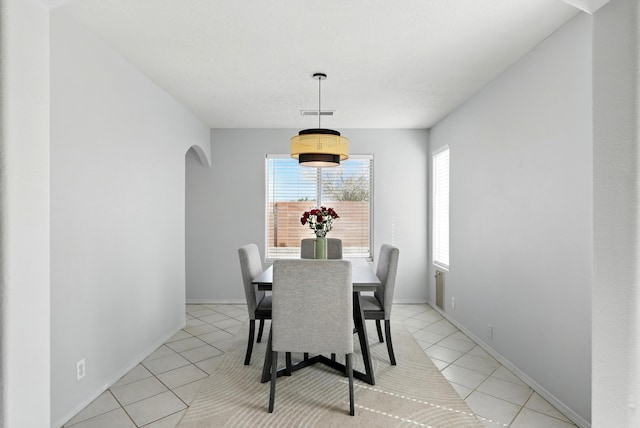 5909 Night Shadow Ave NW, Albuquerque, NM 87114 - dining room with light tile patterned floors and arched walkways