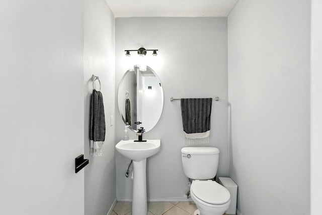 5909 Night Shadow Ave NW, Albuquerque, NM 87114 - bathroom with toilet, tile patterned floors, and baseboards