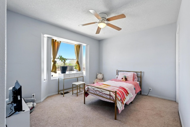 5909 Night Shadow Ave NW, Albuquerque, NM 87114 - bedroom featuring carpet flooring, a textured ceiling, a ceiling fan, and baseboards
