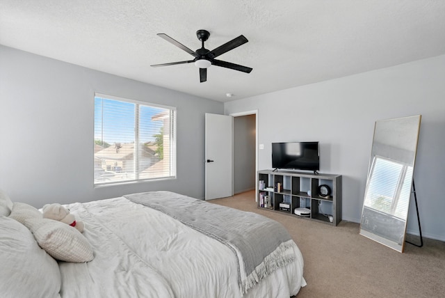 5909 Night Shadow Ave NW, Albuquerque, NM 87114 - bedroom featuring light carpet, ceiling fan, and baseboards