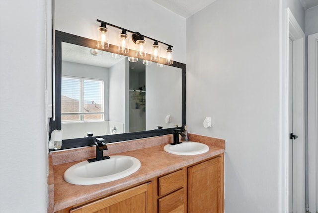 5909 Night Shadow Ave NW, Albuquerque, NM 87114 - bathroom featuring double vanity and a shower