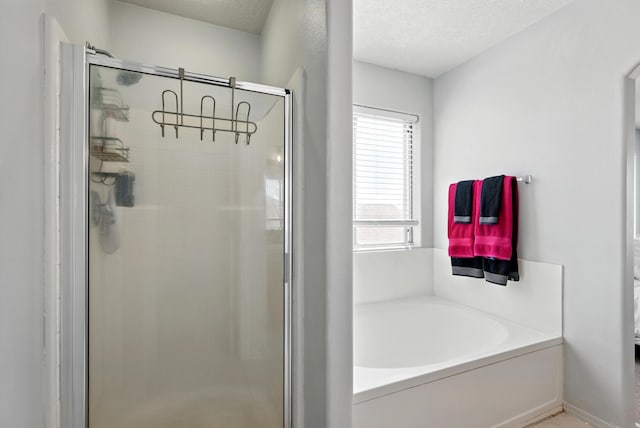 5909 Night Shadow Ave NW, Albuquerque, NM 87114 - full bath with a shower stall, a bath, and a textured ceiling