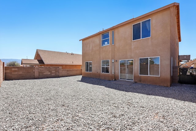 5909 Night Shadow Ave NW, Albuquerque, NM 87114 - back of house featuring a fenced backyard and stucco siding