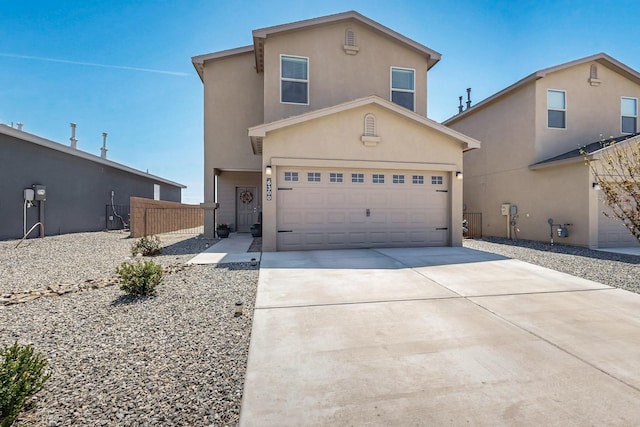 6300 Gannett Dr NE, Rio Rancho, NM 87144 - traditional-style house with driveway, an attached garage, and stucco siding