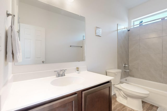 6300 Gannett Dr NE, Rio Rancho, NM 87144 - bathroom featuring vanity, wood finished floors, and washtub / shower combination
