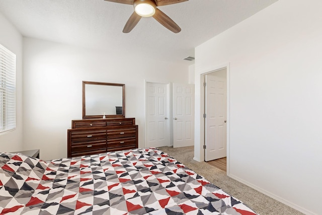 6300 Gannett Dr NE, Rio Rancho, NM 87144 - carpeted bedroom with multiple windows and ceiling fan