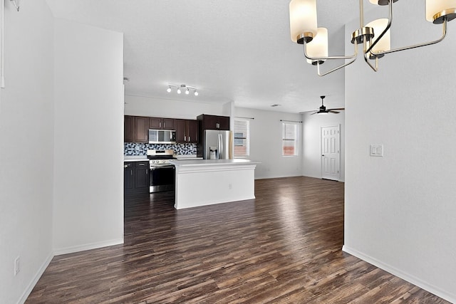 6300 Gannett Dr NE, Rio Rancho, NM 87144 - kitchen featuring stainless steel appliances, open floor plan, dark wood-style floors, dark brown cabinetry, and a ceiling fan