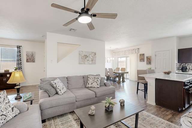 6300 Gannett Dr NE, Rio Rancho, NM 87144 - living room with wood finished floors and a ceiling fan