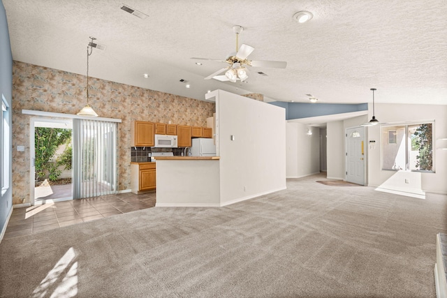 275 Chaparral Loop SE, Rio Rancho, NM 87124 - unfurnished living room with ceiling fan, lofted ceiling, a textured ceiling, and visible vents