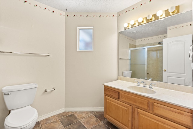 275 Chaparral Loop SE, Rio Rancho, NM 87124 - full bath with toilet, a textured ceiling, a stall shower, vanity, and baseboards