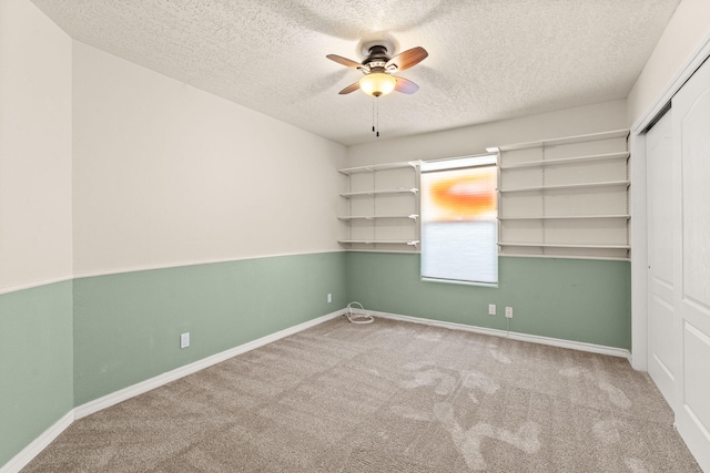 275 Chaparral Loop SE, Rio Rancho, NM 87124 - unfurnished bedroom featuring carpet floors, a textured ceiling, and a closet