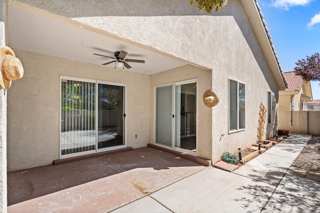 275 Chaparral Loop SE, Rio Rancho, NM 87124 - back of property with fence, a patio area, ceiling fan, and stucco siding