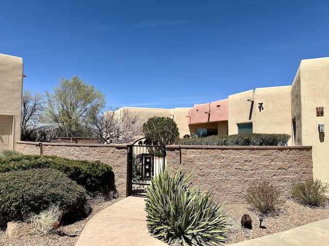 view of gate featuring fence