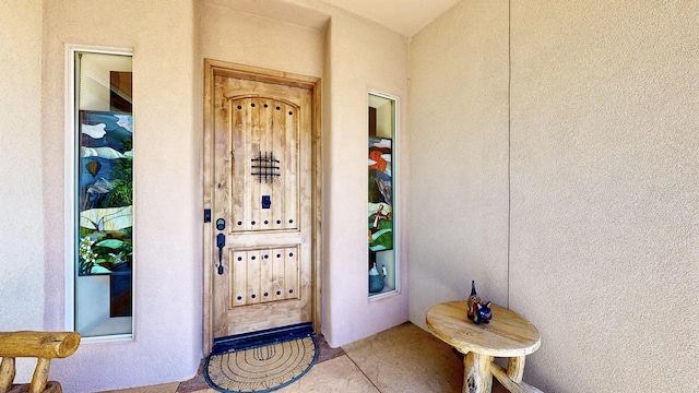 doorway to property with stucco siding