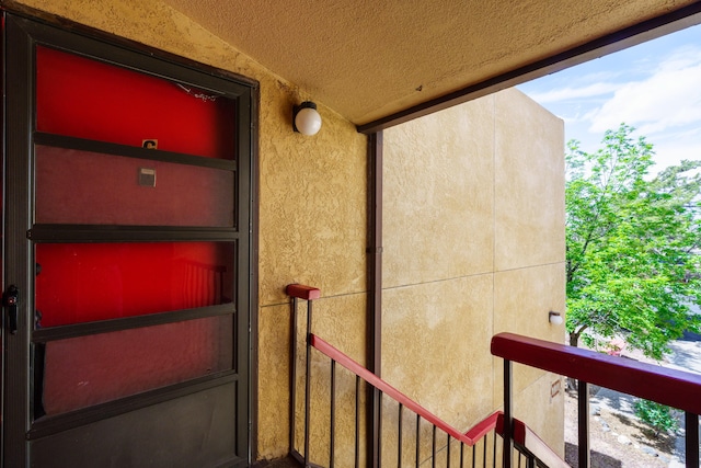 view of exterior entry with stucco siding