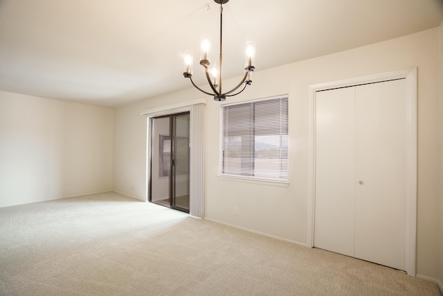 interior space with a notable chandelier and carpet