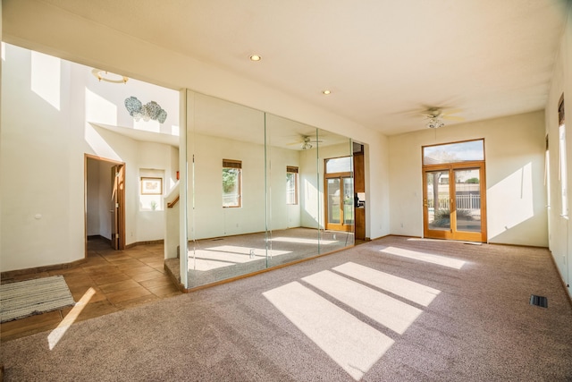 empty room featuring baseboards, visible vents, carpet, recessed lighting, and a ceiling fan