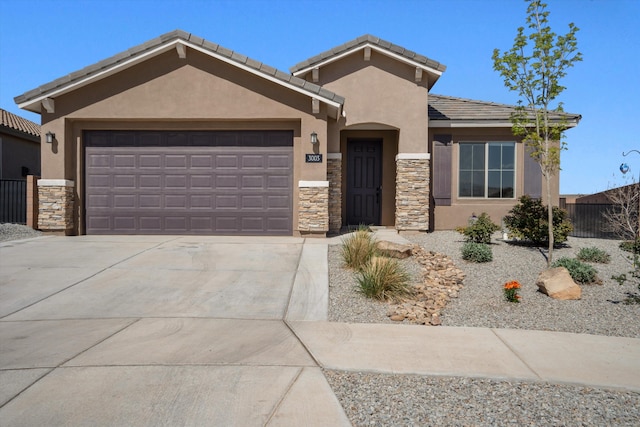 3003 Turquesa SE, Rio Rancho, NM 87124 - view of front facade with stone siding, stucco siding, an attached garage, and concrete driveway