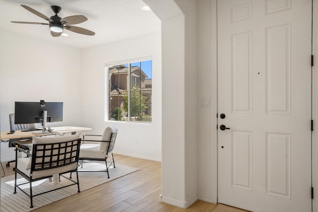 3003 Turquesa SE, Rio Rancho, NM 87124 - home office featuring baseboards, light wood-style floors, ceiling fan, and arched walkways