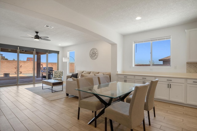 3003 Turquesa SE, Rio Rancho, NM 87124 - dining space featuring a textured ceiling, light wood finished floors, ceiling fan, and recessed lighting