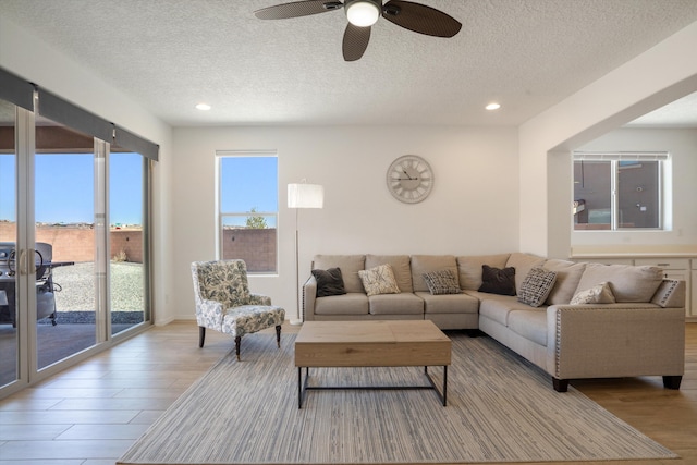 3003 Turquesa SE, Rio Rancho, NM 87124 - living room with a textured ceiling, wood finished floors, ceiling fan, and recessed lighting