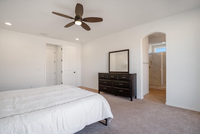 3003 Turquesa SE, Rio Rancho, NM 87124 - bedroom with arched walkways, recessed lighting, light carpet, ceiling fan, and baseboards