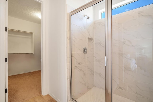 3003 Turquesa SE, Rio Rancho, NM 87124 - full bathroom with a shower stall, baseboards, and a textured ceiling