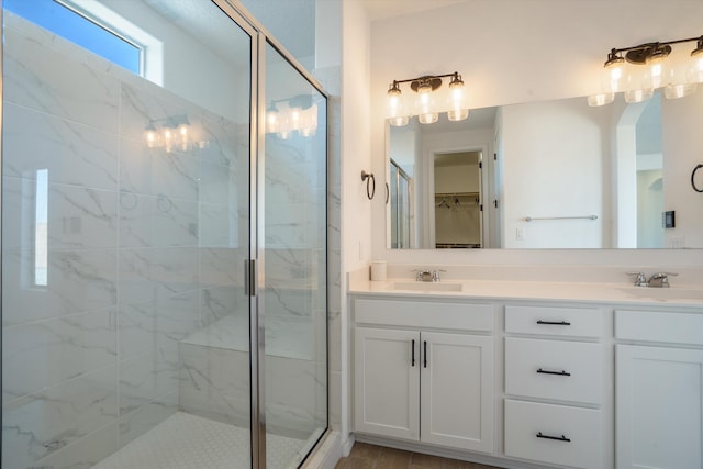 3003 Turquesa SE, Rio Rancho, NM 87124 - bathroom with a stall shower, a spacious closet, and double vanity