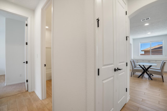3003 Turquesa SE, Rio Rancho, NM 87124 - hall featuring light wood-type flooring, recessed lighting, baseboards, and arched walkways