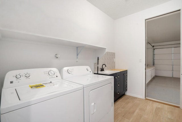 3003 Turquesa SE, Rio Rancho, NM 87124 - laundry room with cabinet space, separate washer and dryer, and light wood-type flooring