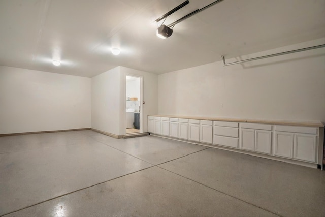 3003 Turquesa SE, Rio Rancho, NM 87124 - garage featuring a garage door opener and baseboards