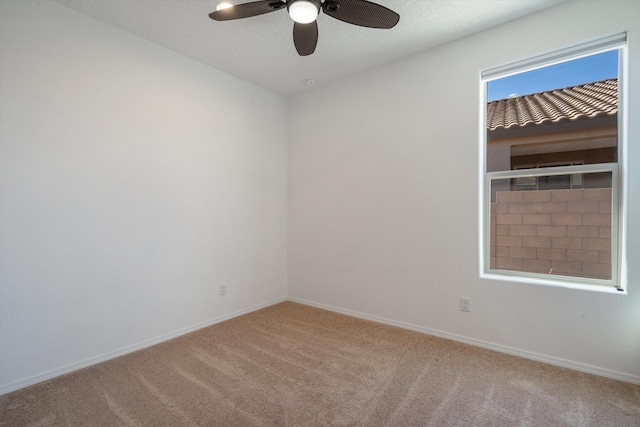 3003 Turquesa SE, Rio Rancho, NM 87124 - spare room featuring carpet flooring, ceiling fan, and baseboards
