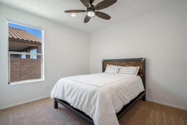 3003 Turquesa SE, Rio Rancho, NM 87124 - carpeted bedroom with baseboards and ceiling fan
