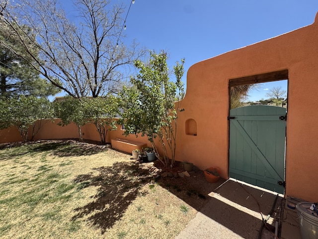 view of yard featuring a gate and fence private yard