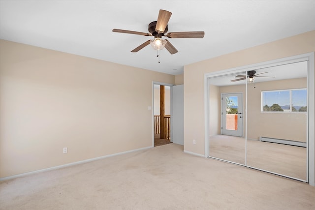unfurnished bedroom with baseboards, ceiling fan, baseboard heating, access to outside, and carpet