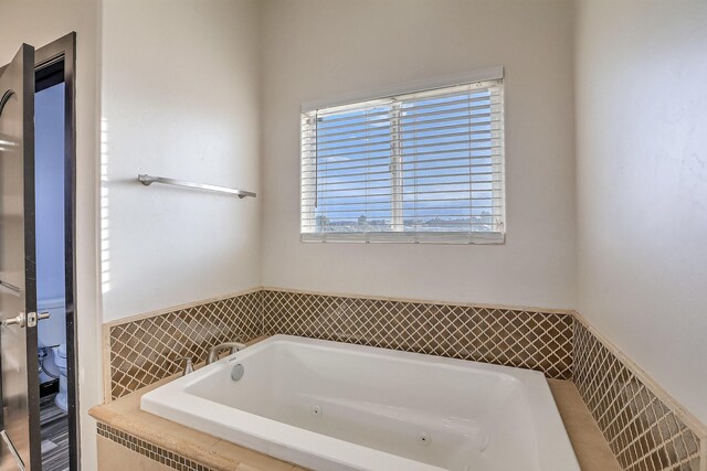 1797 Vargas Rd SE, Rio Rancho, NM 87124 - bathroom with a whirlpool tub and wainscoting