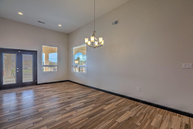 1797 Vargas Rd SE, Rio Rancho, NM 87124 - spare room featuring wood finished floors, a chandelier, and recessed lighting