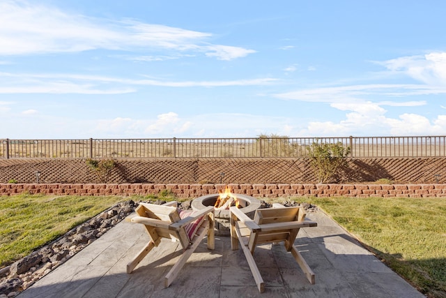 9109 Retablo Rd NW, Albuquerque, NM 87120 - view of patio featuring a fenced backyard and an outdoor fire pit