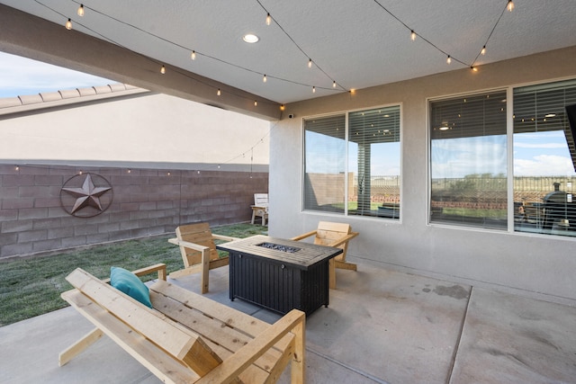 9109 Retablo Rd NW, Albuquerque, NM 87120 - view of patio featuring a fire pit and fence