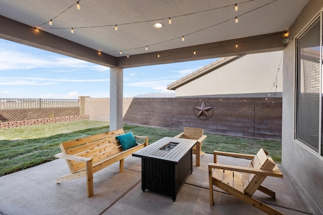 9109 Retablo Rd NW, Albuquerque, NM 87120 - view of patio / terrace featuring a fenced backyard and a fire pit