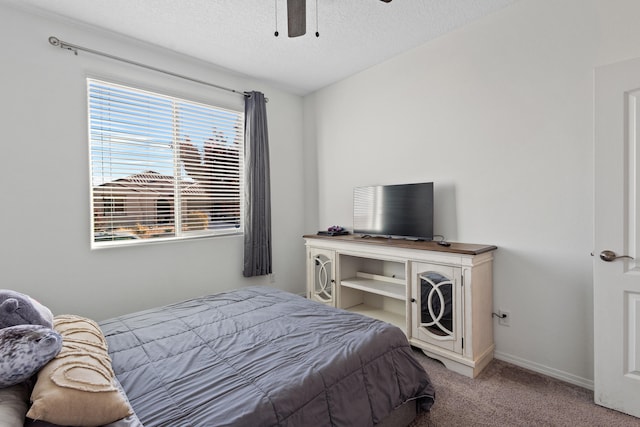 9109 Retablo Rd NW, Albuquerque, NM 87120 - bedroom with baseboards, carpet floors, a textured ceiling, and ceiling fan