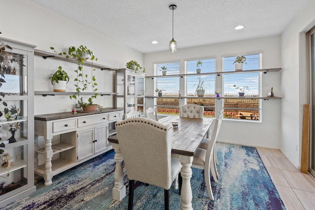 9109 Retablo Rd NW, Albuquerque, NM 87120 - dining area with light tile patterned flooring, a textured ceiling, and recessed lighting