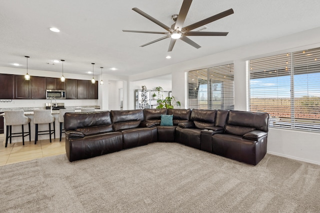 9109 Retablo Rd NW, Albuquerque, NM 87120 - living area featuring recessed lighting, light carpet, baseboards, and ceiling fan