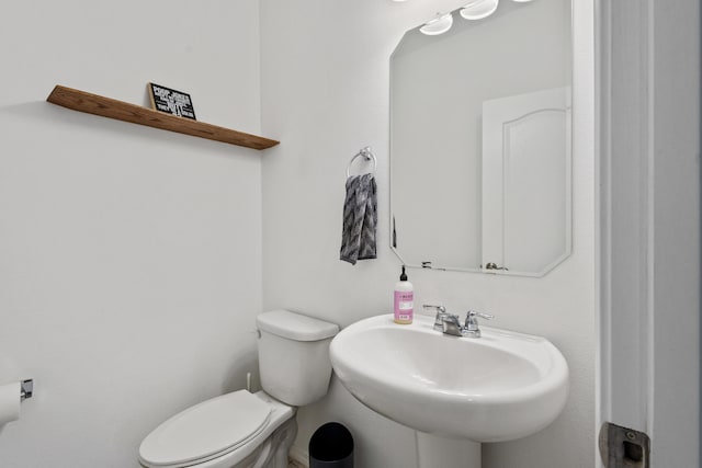 9109 Retablo Rd NW, Albuquerque, NM 87120 - bathroom featuring toilet and a sink