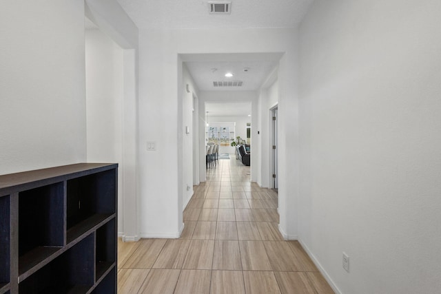 9109 Retablo Rd NW, Albuquerque, NM 87120 - hall with recessed lighting, visible vents, and baseboards