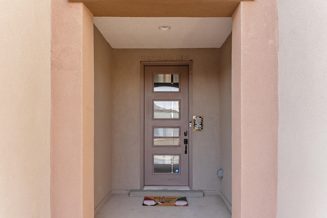9109 Retablo Rd NW, Albuquerque, NM 87120 - entrance to property with stucco siding