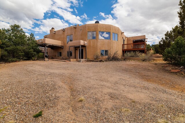 rear view of house with a balcony