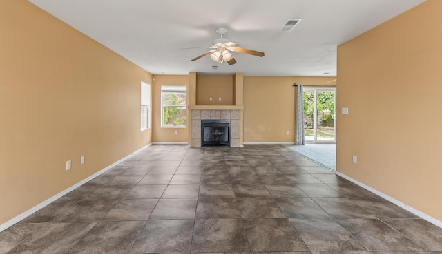7419 Tolleson Ave NW, Albuquerque, NM 87114 - unfurnished living room featuring a wealth of natural light, a ceiling fan, baseboards, and visible vents